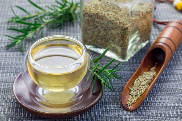 istock Herbal rosemary tea in a glass cup on oriental background, horizontal 673777356