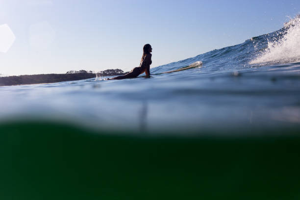 istock Silhouetted Surfer Girl 673780300