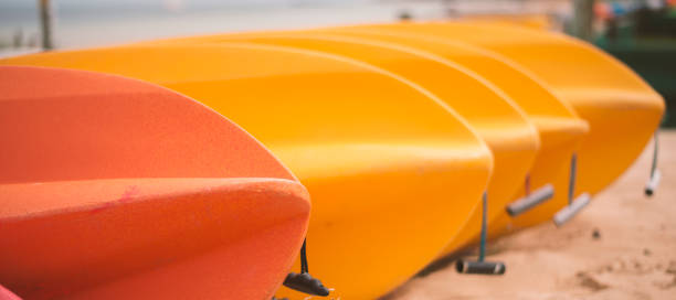 istock Kayaks on the beach during the day 673780482