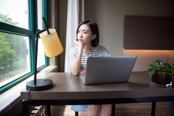 istock Young beautiful girl using laptop at home 673784634