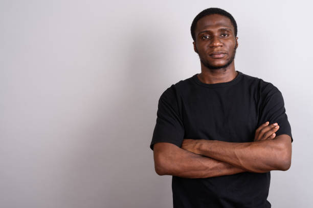 istock Studio shot of young African man against gray background 673787654