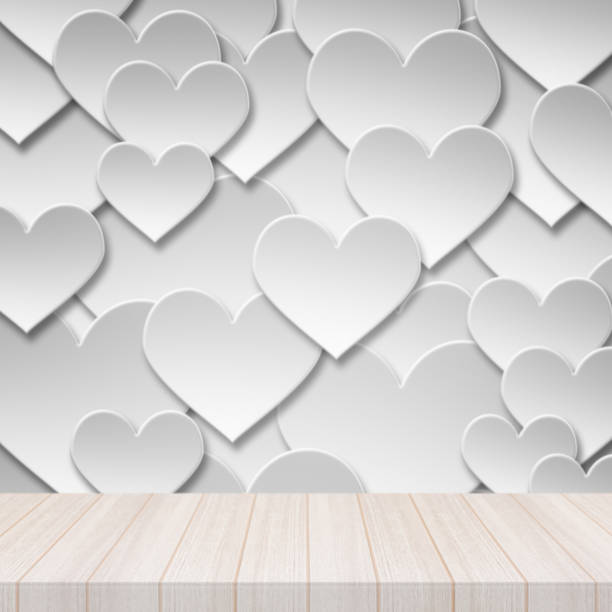 istock Perspective white wood table top with Paper valentine love heart symbol background. 673787946