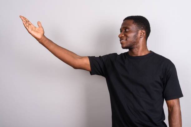 istock Studio shot of young African man against gray background 673788250