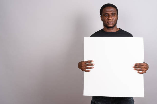 istock Studio shot of young African man against gray background 673788294