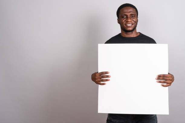 istock Studio shot of young African man against gray background 673788310