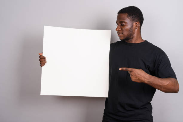 istock Studio shot of young African man against gray background 673788344