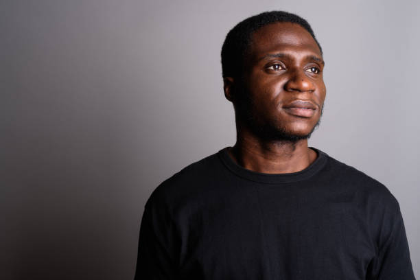 istock Studio shot of young African man against gray background 673788562