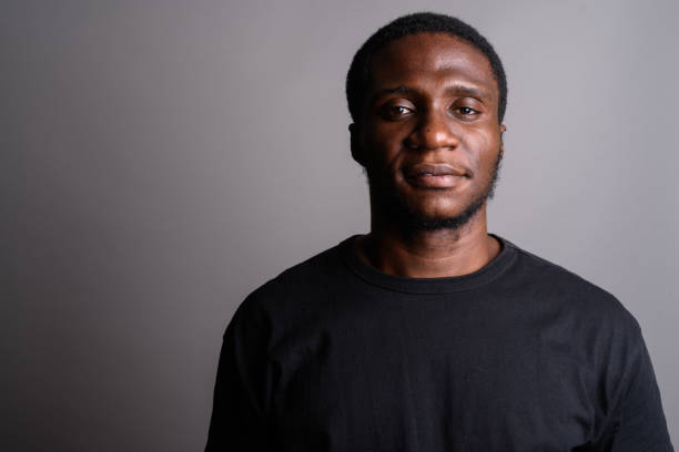 istock Face of young African man against gray background 673788636