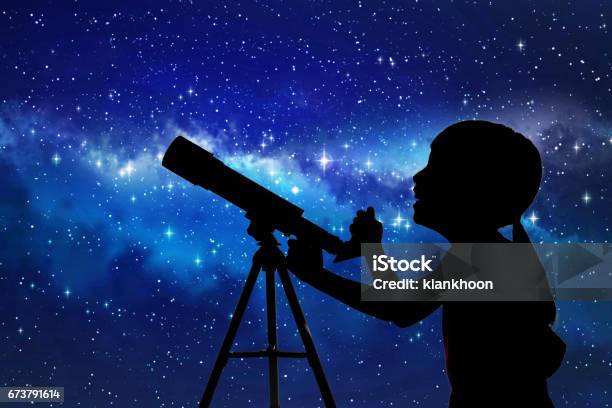 Silhouette Of Little Girl Looking Through A Telescope Stock Photo - Download Image Now