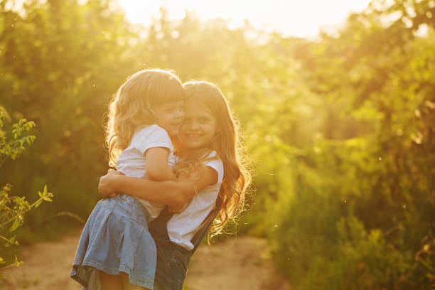 istock Two little sisters hugged strongly. 673795492