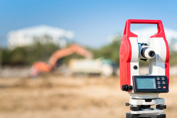 istock Surveyor equipment theodolite outdoors at construction site 673798454