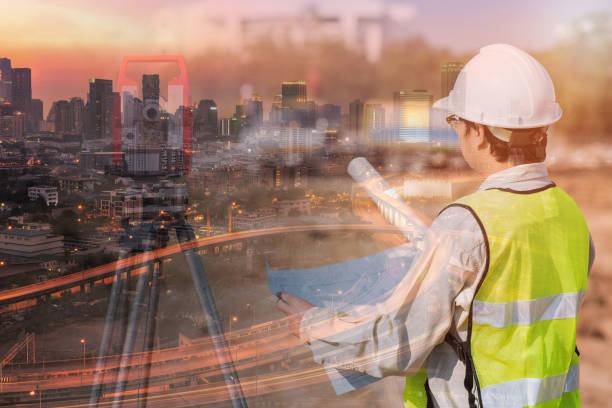 istock Double exposure of construction engineer checking construction drawing at site area and modern downtown 673798520