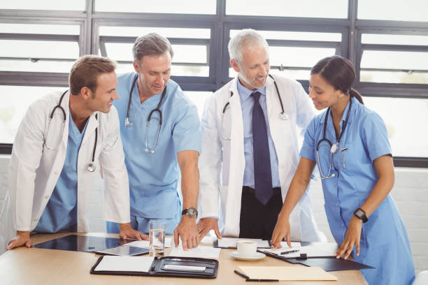istock Medical team interacting in conference room 673798908