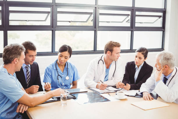 istock Medical team interacting with each other 673799050
