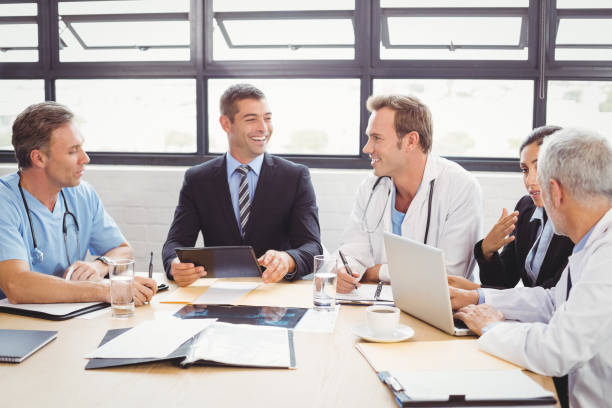 istock Medical team interacting in conference room 673801426