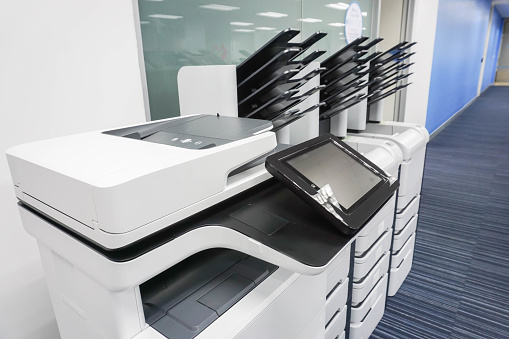 close up office printers set up ready for printing business documents