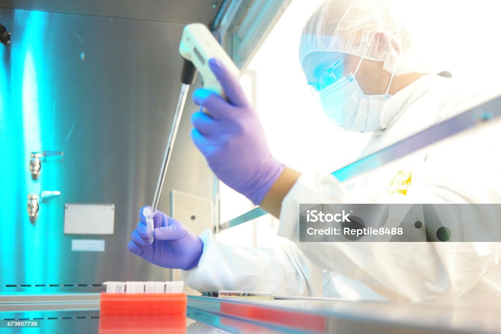 Aseptic Processing Aseptic processing in a clean room laboratory Pharmaceutical Factory Stock Photo