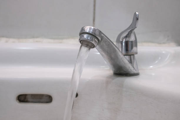 istock Water running from an open water faucet. 673811930