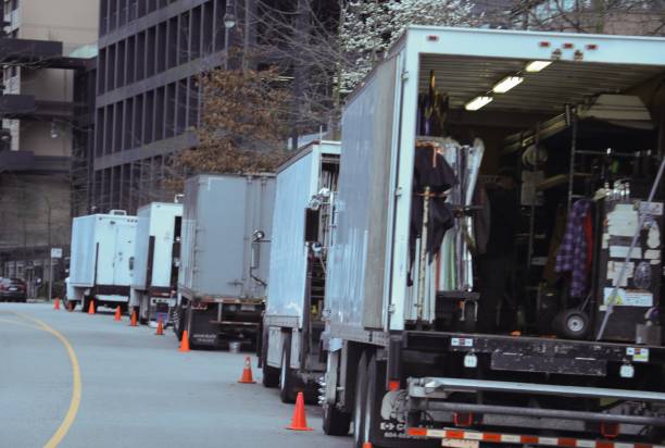 istock Movie set trucks getting ready for a shoot 673815878