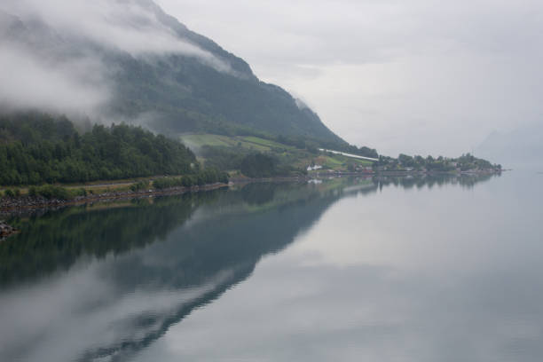istock Norway - ideal fjord reflection in clear water 673818696