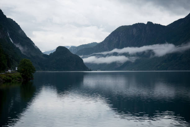 istock Norway - ideal fjord reflection in clear water 673819228
