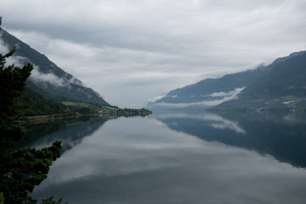 istock Norway - ideal fjord reflection in clear water 673819556