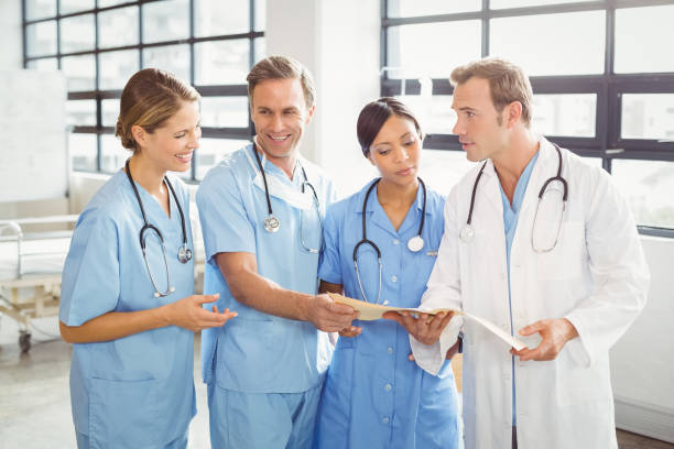 istock Medical team interacting with each other 673819568