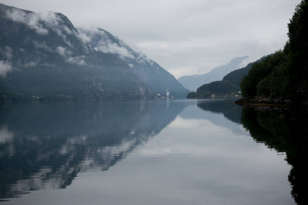 istock Norway - ideal fjord reflection in clear water 673821938