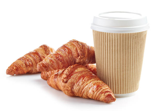 istock paper cup of coffee and croissants 673822182
