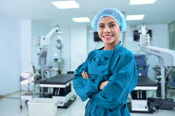 Pretty nurse Beautiful smiling Vietnamese nurse in surgery room anaesthetist stock pictures, royalty-free photos & images