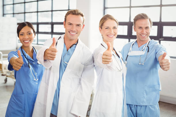 istock Medical team putting their thumbs up and smiling 673823070