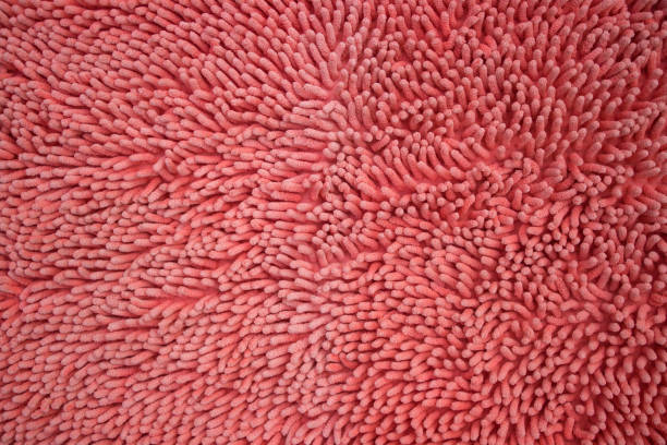 istock Close up texture of red microfiber fabric carpet 673826112
