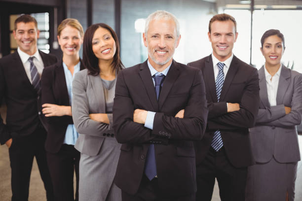 istock Businesspeople standing with arms crossed 673829044