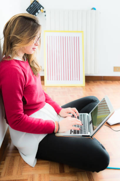 istock Young woman using notebook surfing net with laptop 673837438