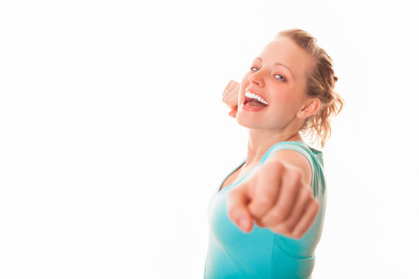 Portrait of Young happy winner woman isolated on white background.