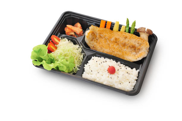 Isolated and clipping path of  dory fish steak set in bento box set