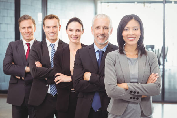 istock Businesspeople standing with arms crossed 673844618