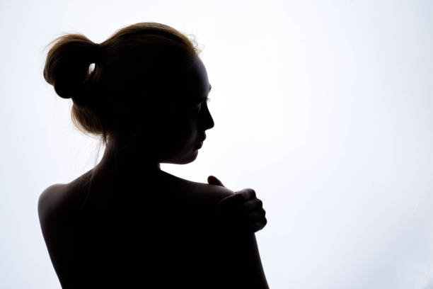 istock silhouette of beautiful young woman 673847656