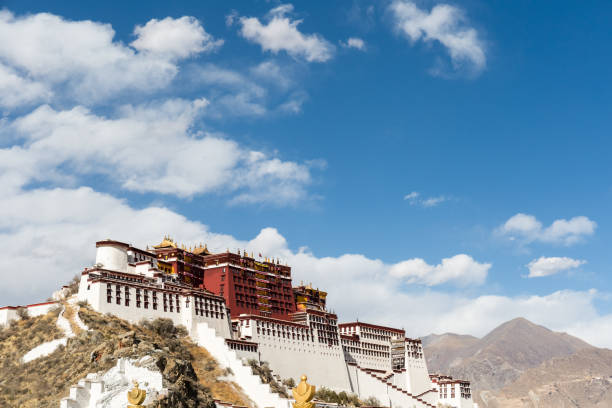 istock the potala palace against a blue sky 673848986