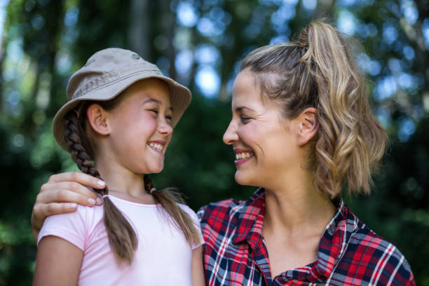 istock Cheerful mother looking at daughter 673850802