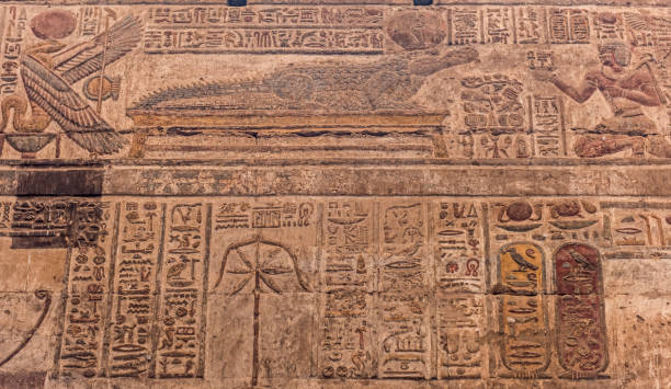 istock Hieroglyphic carvings on an ancient egyptian temple wall 673851216