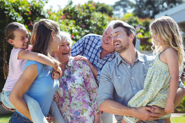 istock Family laughing in back yard 673854256