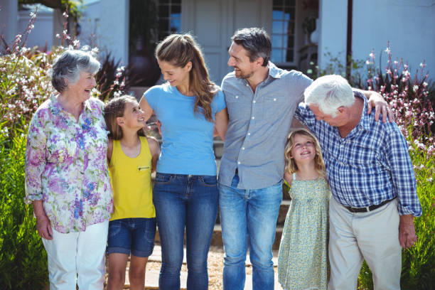 istock Cheerful multi-generation family looking at each other 673854784