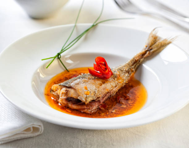 istock Fried Atlantic horse mackerel in a spicy sauce 673864976