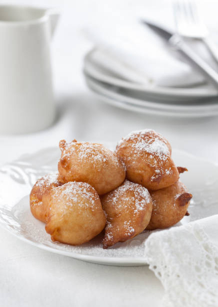 istock Sweet homemade beignets covered with powdered sugar. 673865148