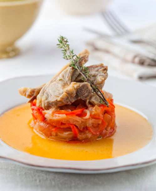 istock Goat cutlets on a bed of fried onion and bell pepper. 673865268