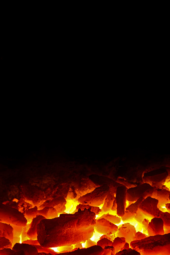 Red hot coal fire with black background