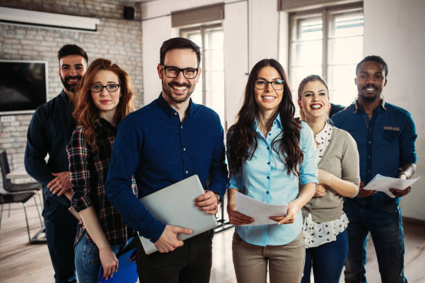 istock Successful company with happy employees in modern office 673872264