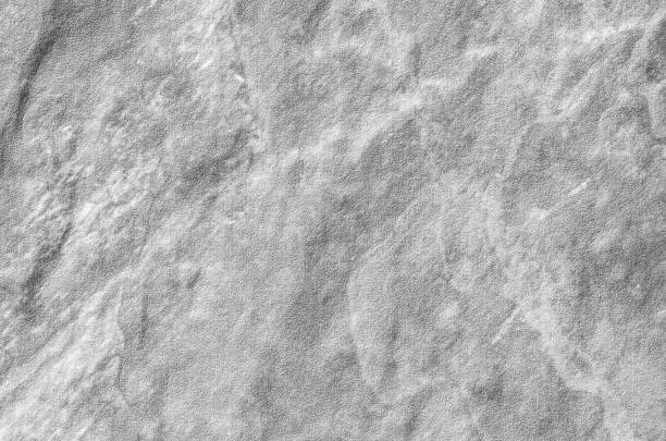 istock Closeup surface at stone pattern at stone brick wall in the garden textured background in black and white tone 673873338