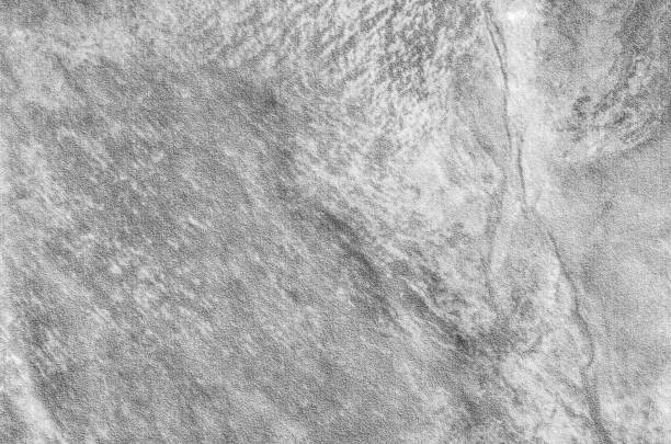 istock Closeup surface at stone pattern at stone brick wall in the garden textured background in black and white tone 673875196